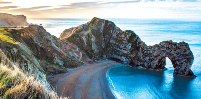 Photo of a beach with rock outcroppings