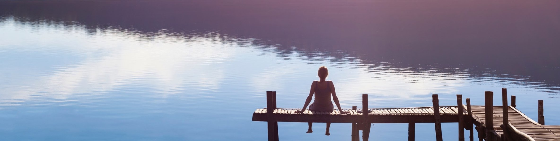 Woman sitting on dock