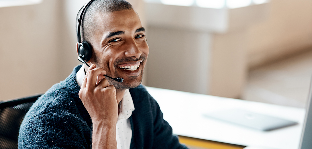 Image of a man wearing a headset and mic