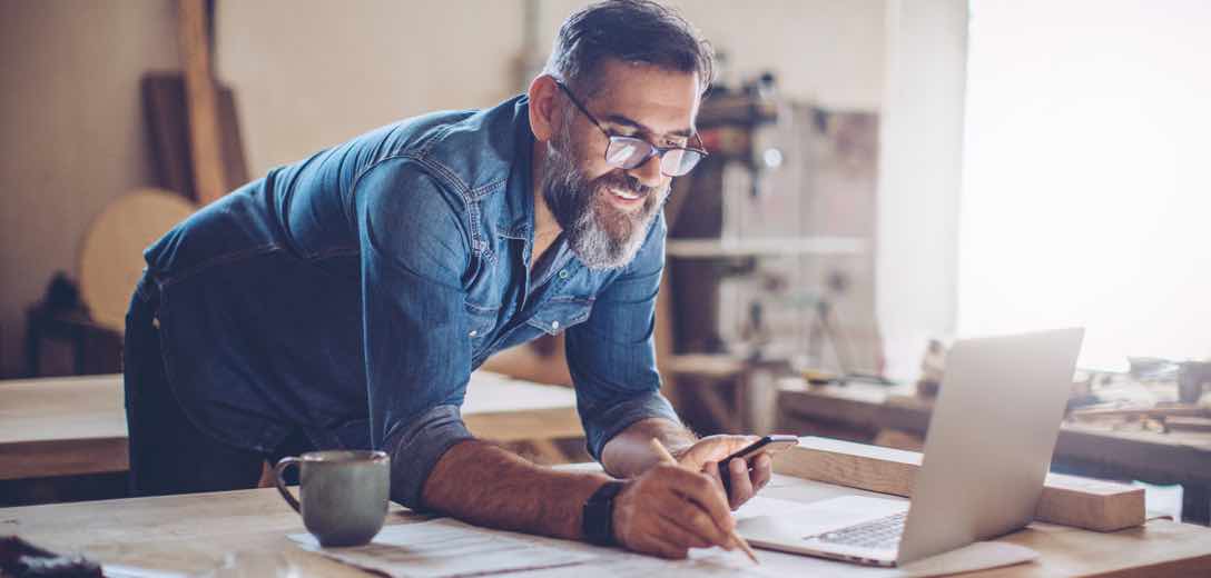 man checking his math happily