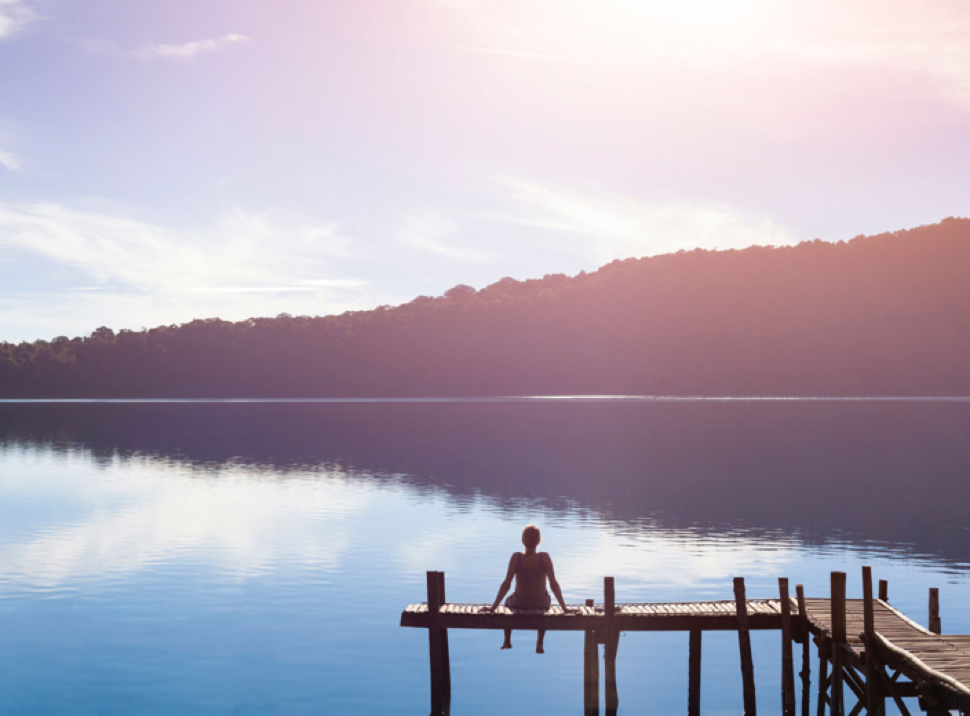 woman sitting on dock